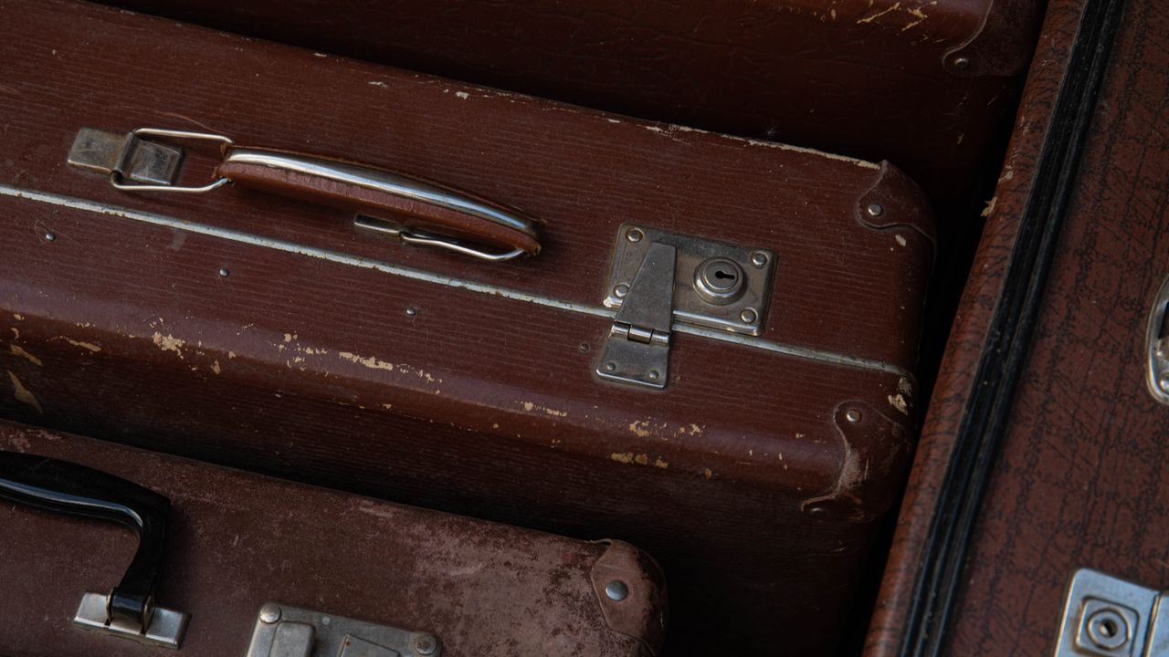 Leather suitcases stacked before packing