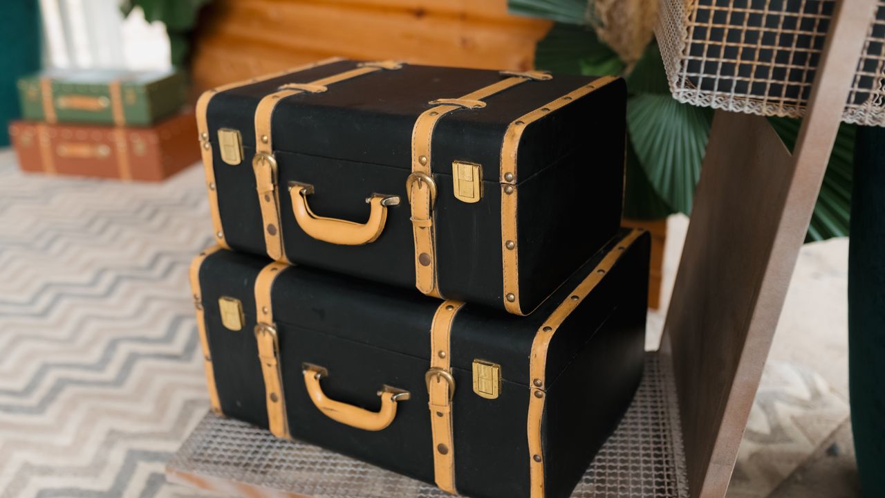 Two hard-shell suitcases standing side by side